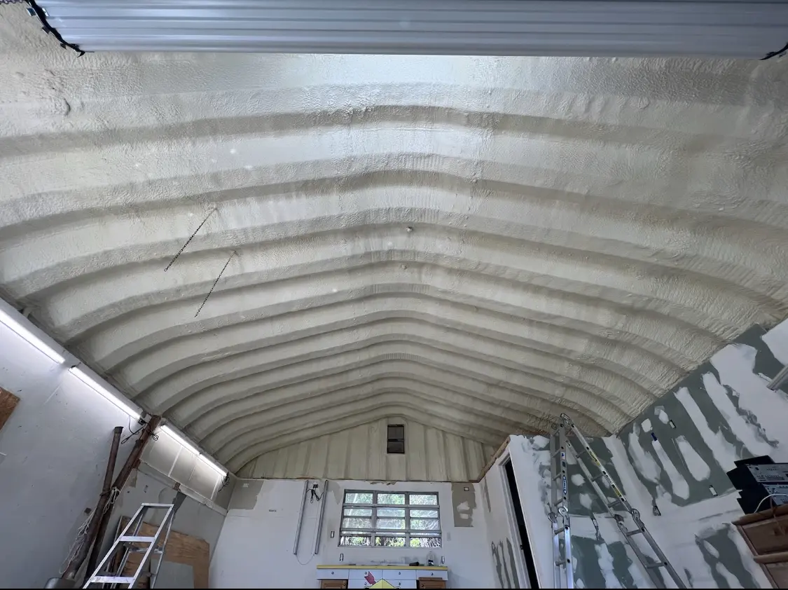 Spray polyurethane foam applied to the underside of a metal roof deck in Monument